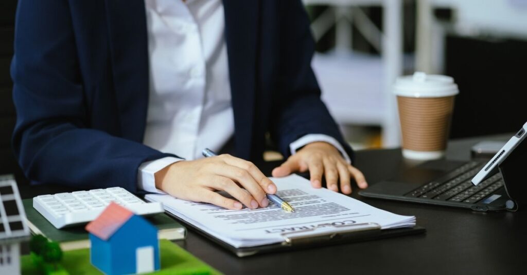 A conveyancer inspects a contract.