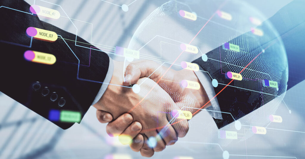 Shaking hands behind a digital graphic.