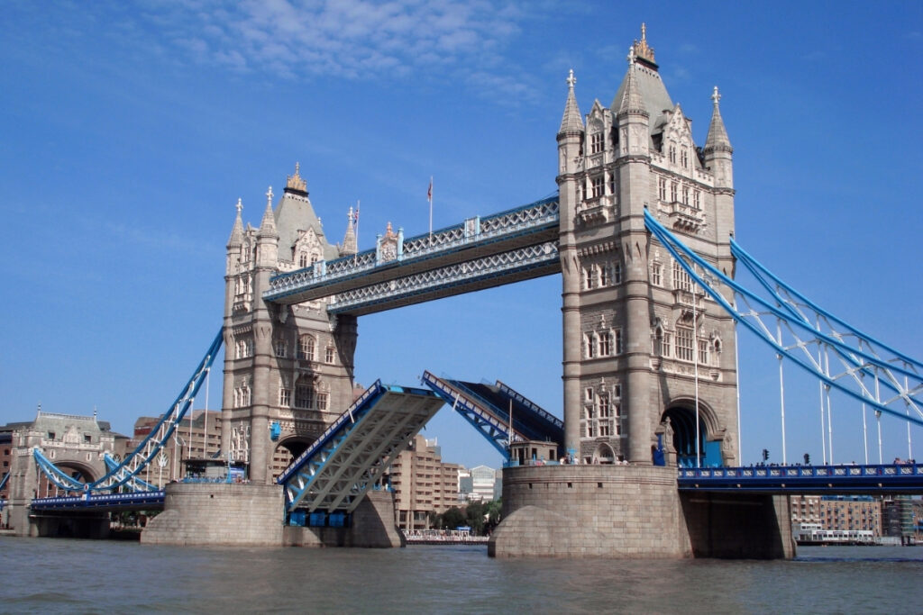 Tower Bridge in London, raising its bridge section to let a boat pass. A landlord check or a right to rent check can be like raising a drawbridge against threats.