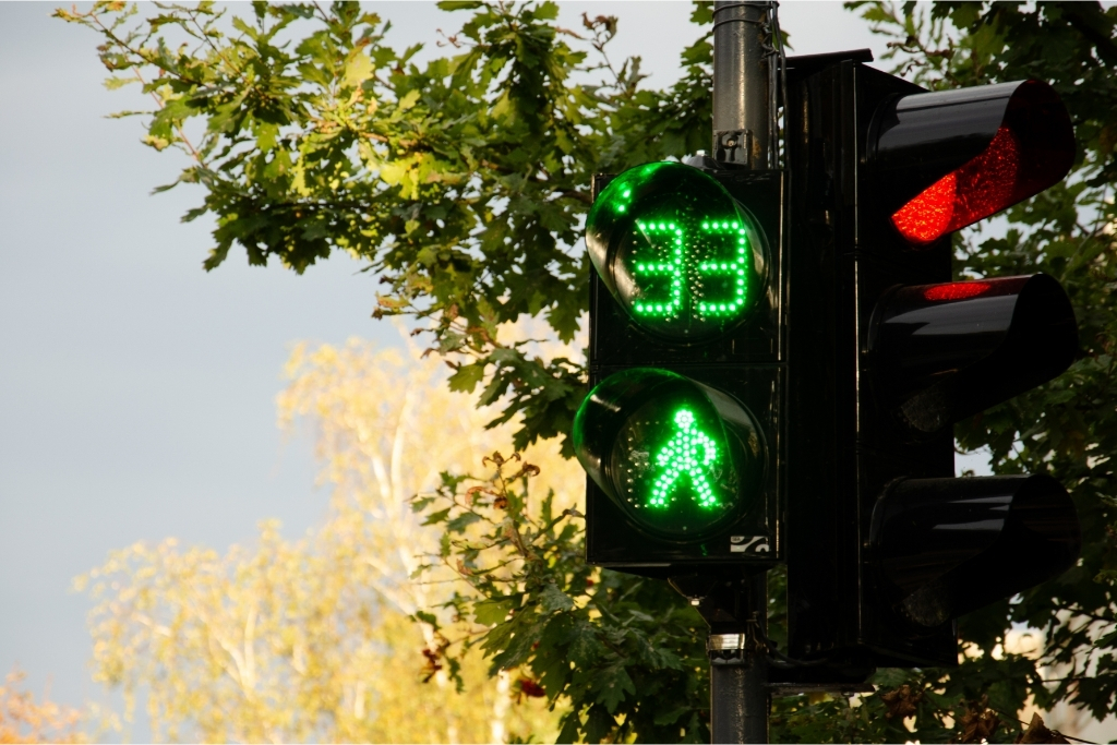 A traffic light countdown, showing the green man.